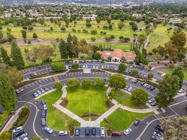 an aerial view of residential house with outdoor space and swimming pool