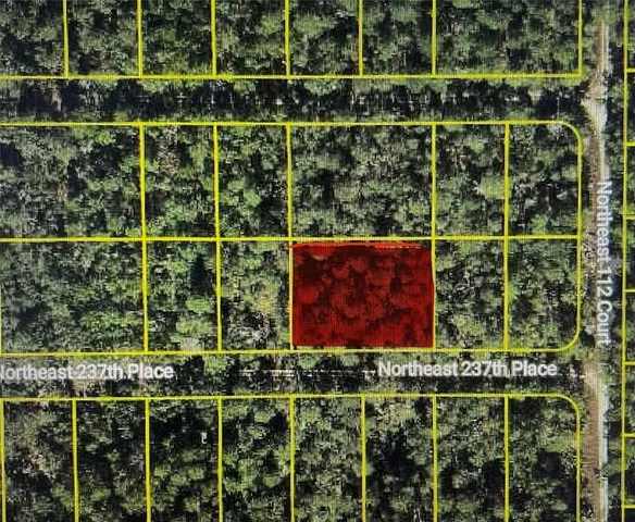 a view of a wooden fence and a window