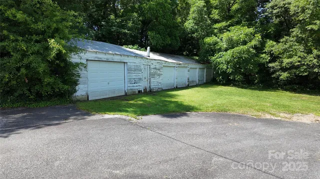 a backyard of a house with garage