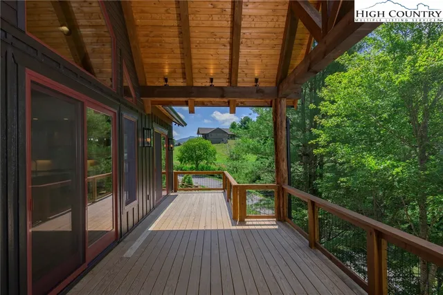 a view of a balcony with wooden floor