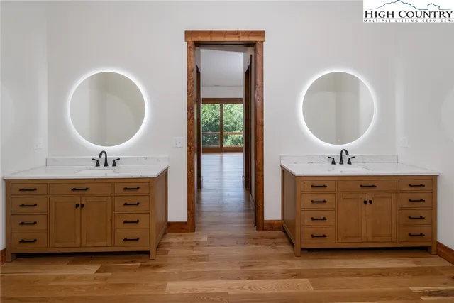 a bathroom with a double vanity sink double and a mirror