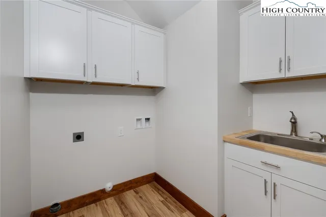 a view of cabinets with wooden floor