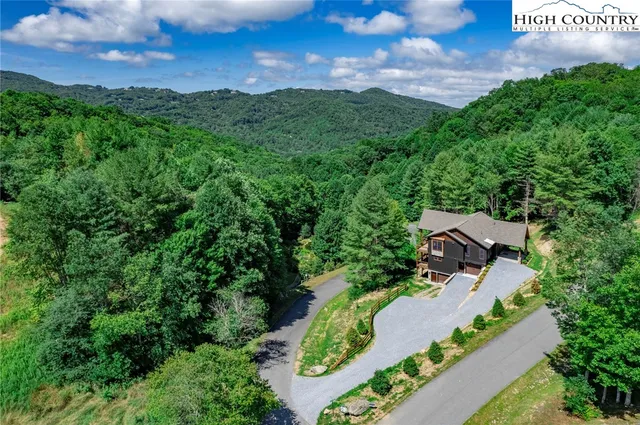 an aerial view of a house with garden space sitting space and mountain view