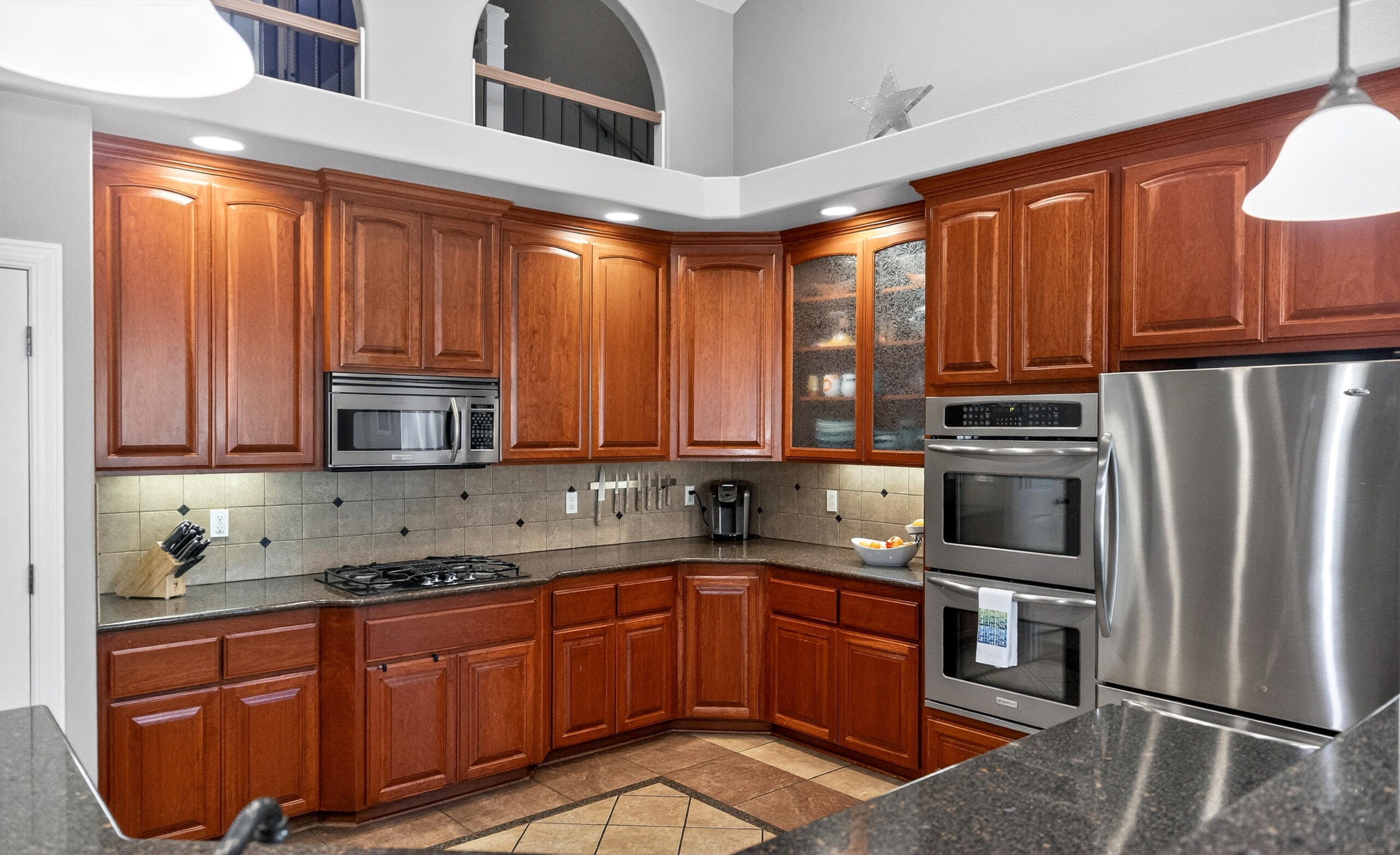 10421 Kestrel Road Klamath Falls, OR 97601 - Photo 22 of 56 a kitchen with stainless steel appliances granite countertop a refrigerator sink and cabinets