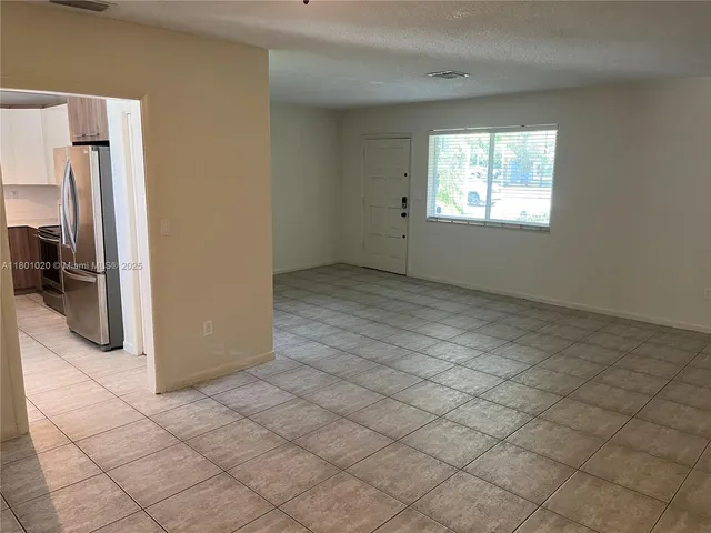 an empty room with a fireplace