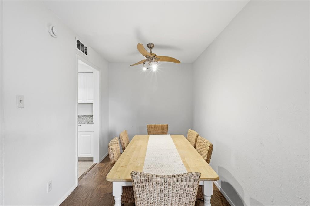 12818 Midway Road, Unit 2078 Dallas, TX 75244 - Photo 12 of 26 a bed room with a bed and a chandelier fan