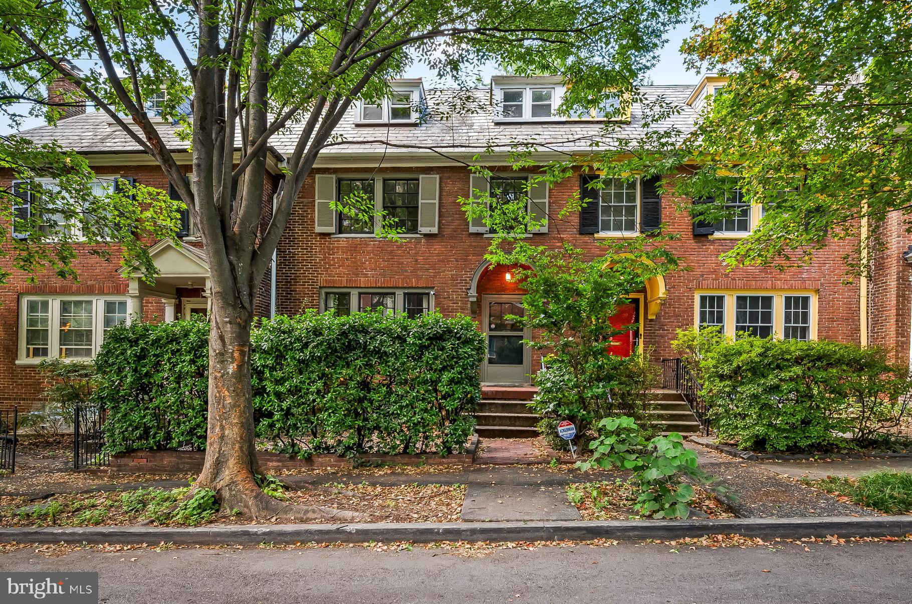 front view of a house with a garden