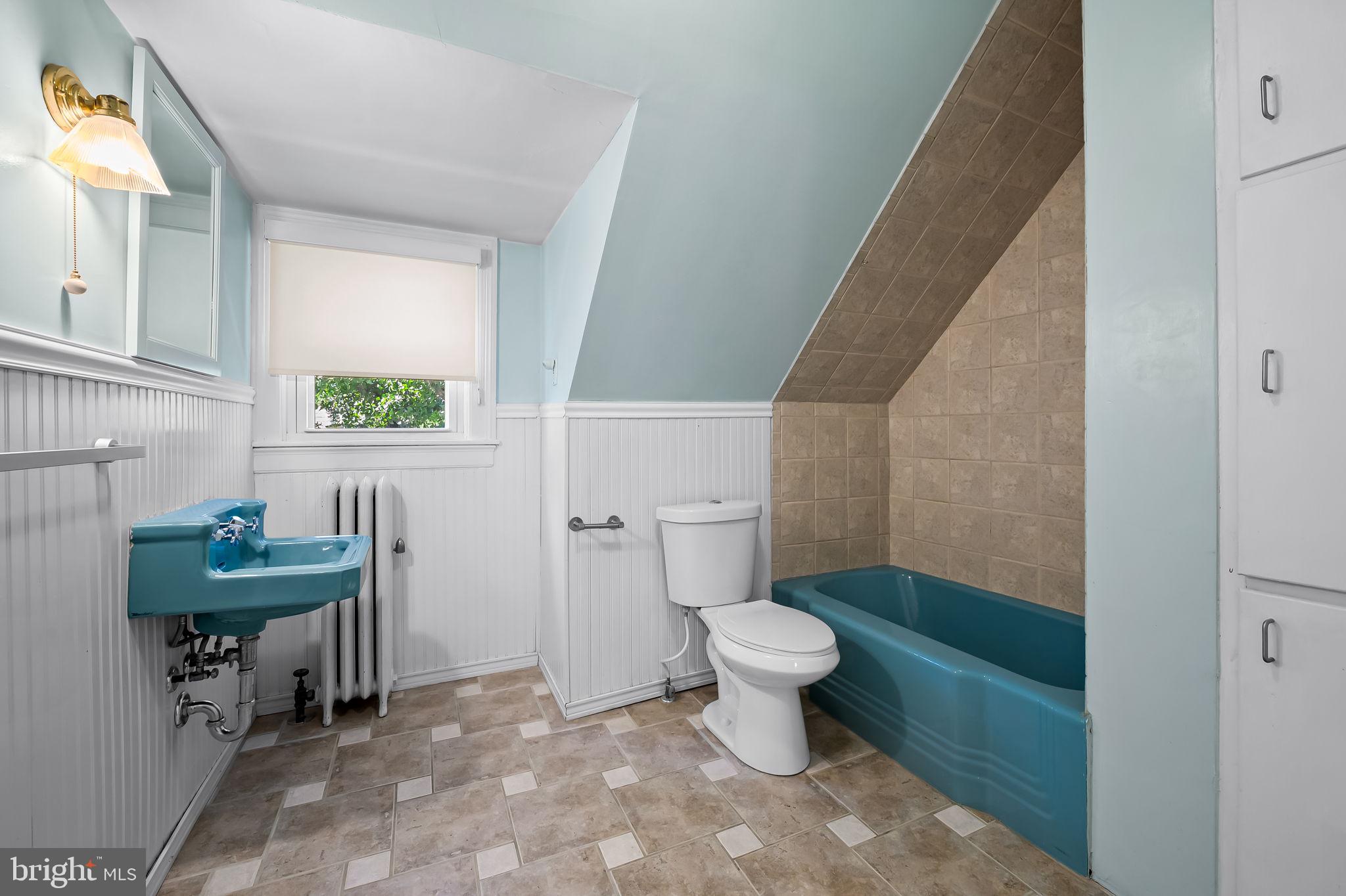 3916 Cloverhill Road Baltimore, MD 21218 - Photo 36 of 47 a bathroom with a toilet a sink and a mirror