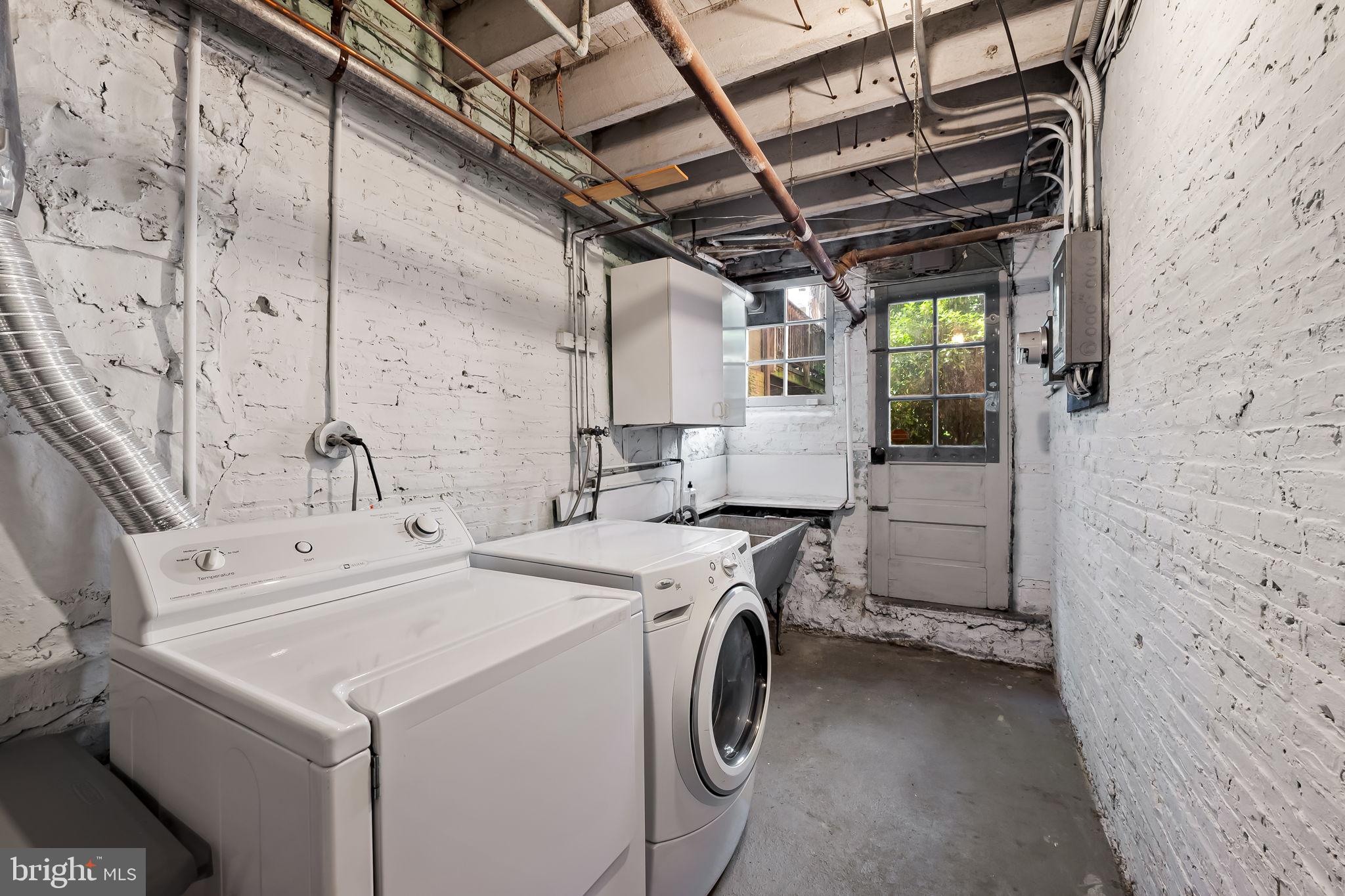 3916 Cloverhill Road Baltimore, MD 21218 - Photo 38 of 47 a utility room with dryer and washer