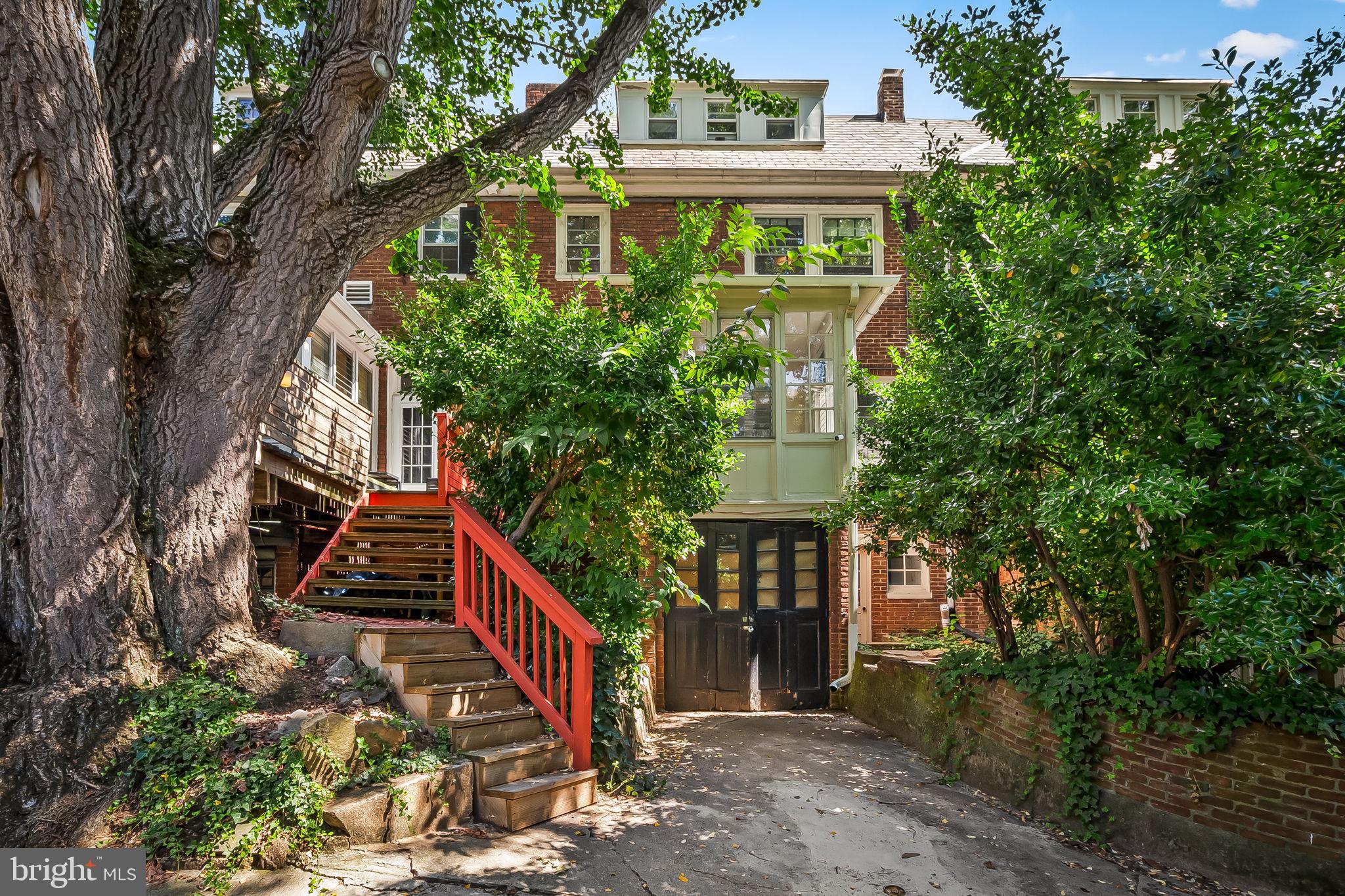 3916 Cloverhill Road Baltimore, MD 21218 - Photo 43 of 47 a front view of house along with deck and outdoor seating