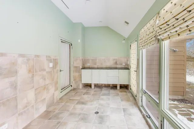 a bathroom with a bathtub and a window