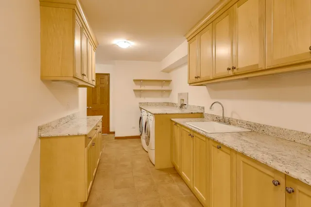 a bathroom with a bathtub shower sink and mirror