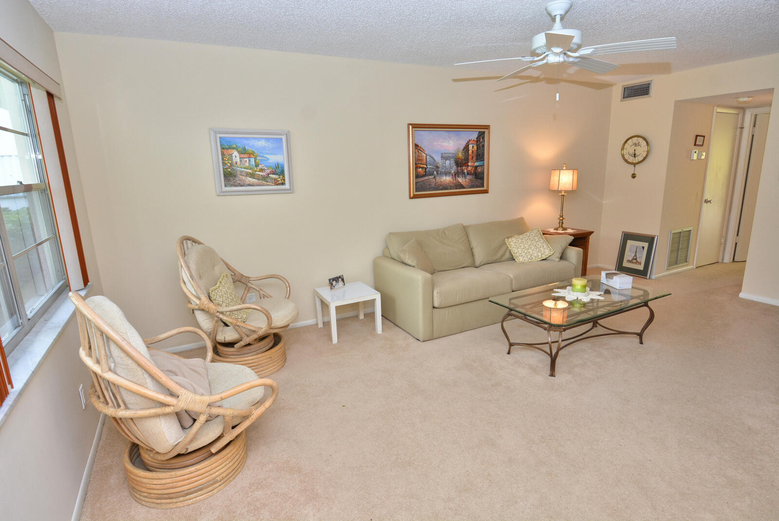 1225 Northwest 21st Street, Unit 2105 Stuart, FL 34994 - Photo 14 of 34 a living room with furniture and a chandelier