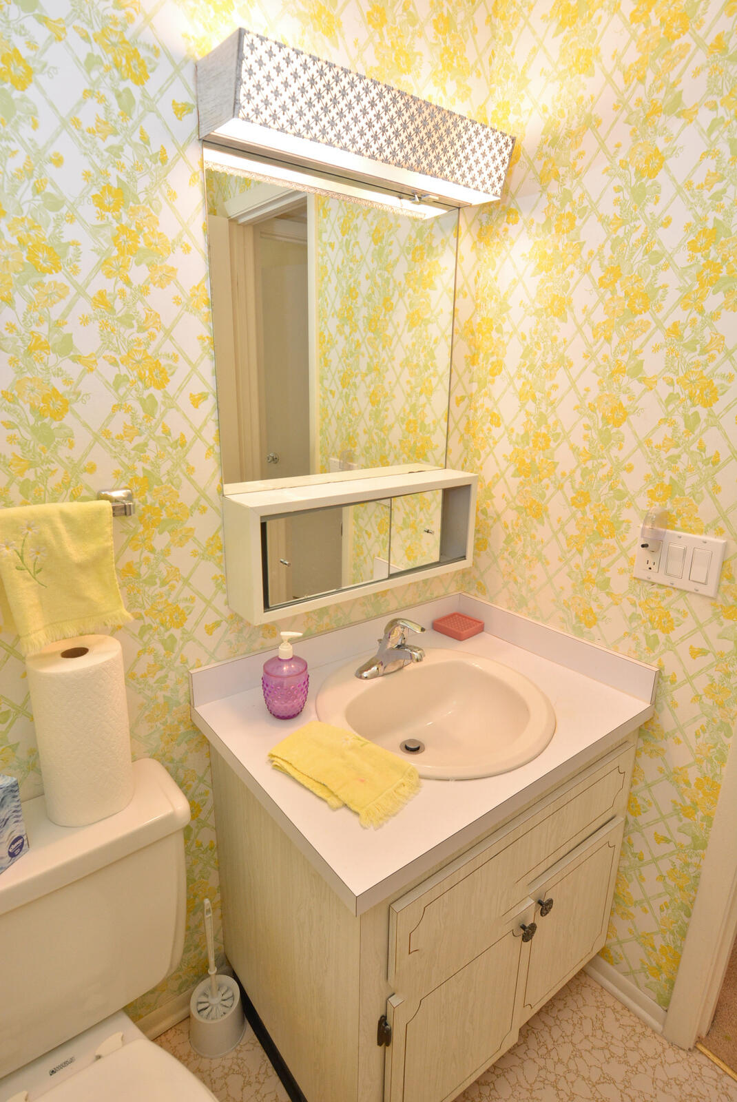 1225 Northwest 21st Street, Unit 2105 Stuart, FL 34994 - Photo 15 of 34 a bathroom with a sink and a mirror
