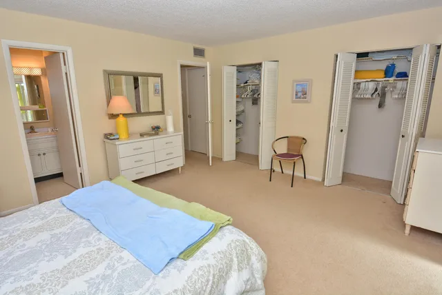 a bedroom with a bed and a table in it