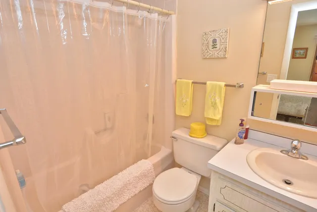 a bathroom with a toilet a sink and a bathtub