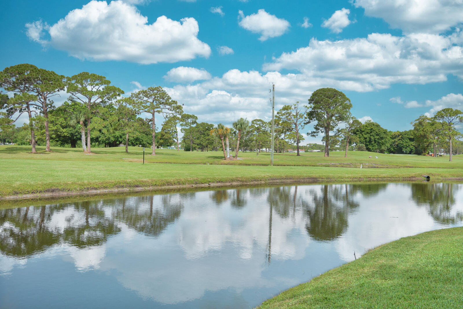 1225 Northwest 21st Street, Unit 2105 Stuart, FL 34994 - Photo 2 of 34 a view of a lake with a big yard