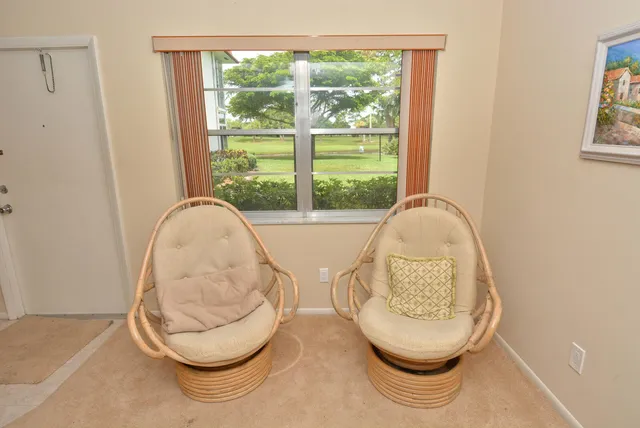 a room with wooden floor and a painting on the wall