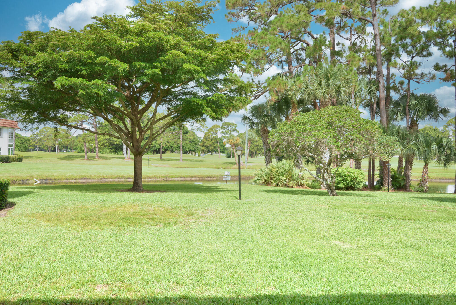 1225 Northwest 21st Street, Unit 2105 Stuart, FL 34994 - Photo 3 of 34 a view of a field with tree s