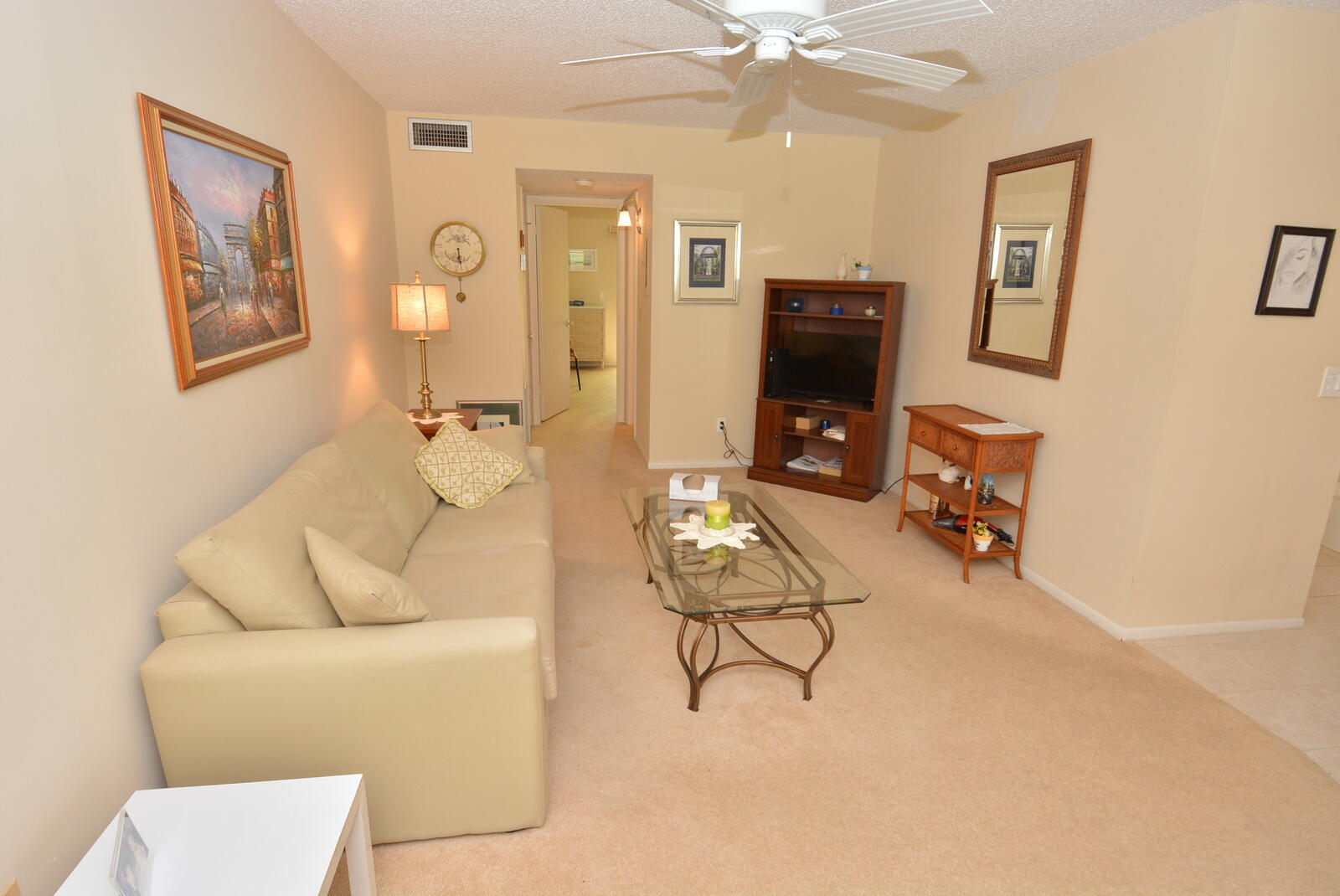 1225 Northwest 21st Street, Unit 2105 Stuart, FL 34994 - Photo 5 of 34 a living room with furniture and a wooden floor