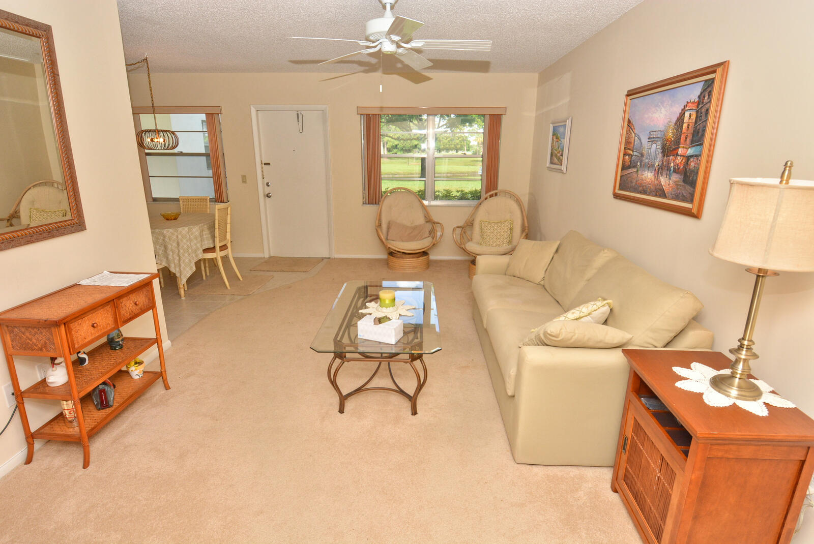 1225 Northwest 21st Street, Unit 2105 Stuart, FL 34994 - Photo 7 of 34 a living room with furniture and a window