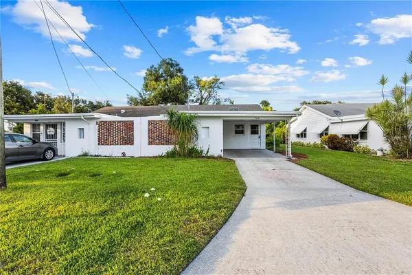 front view of a house with a yard