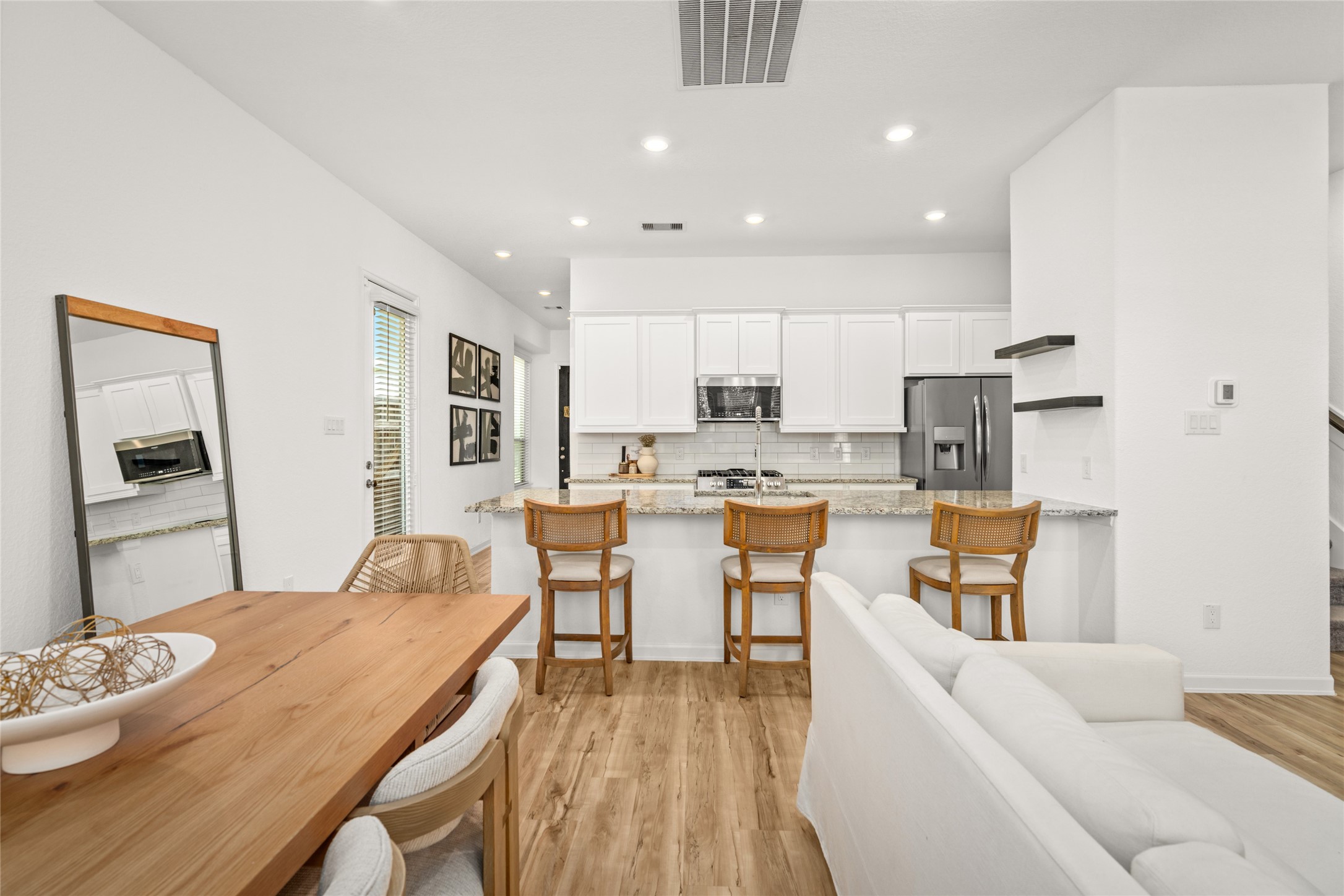 575 Dry Fork Lane Conroe, TX 77304 - Photo 11 of 34 a living room with stainless steel appliances kitchen island granite countertop furniture and a dining table