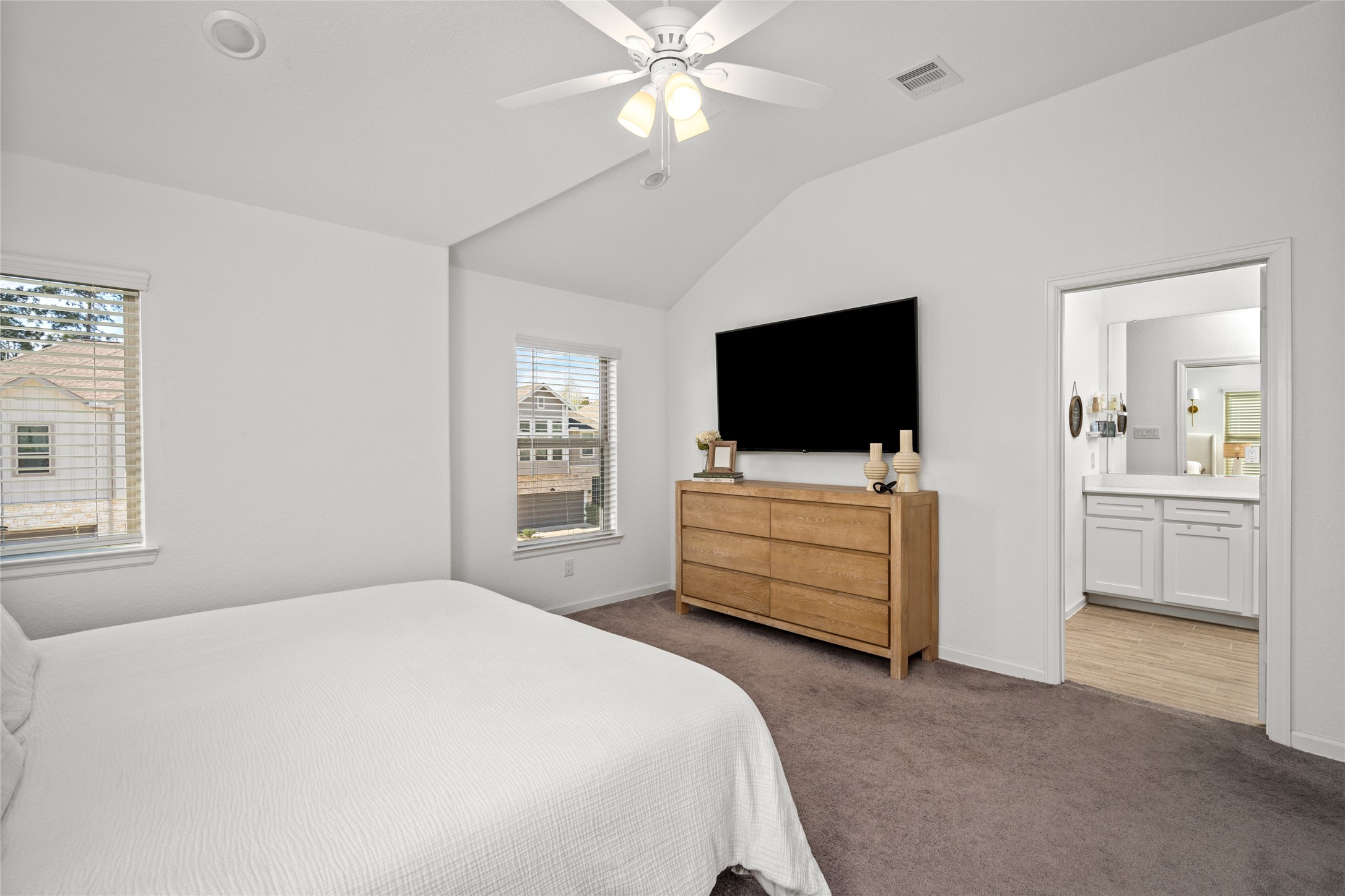 575 Dry Fork Lane Conroe, TX 77304 - Photo 17 of 34 a bedroom with a bed and a flat screen tv