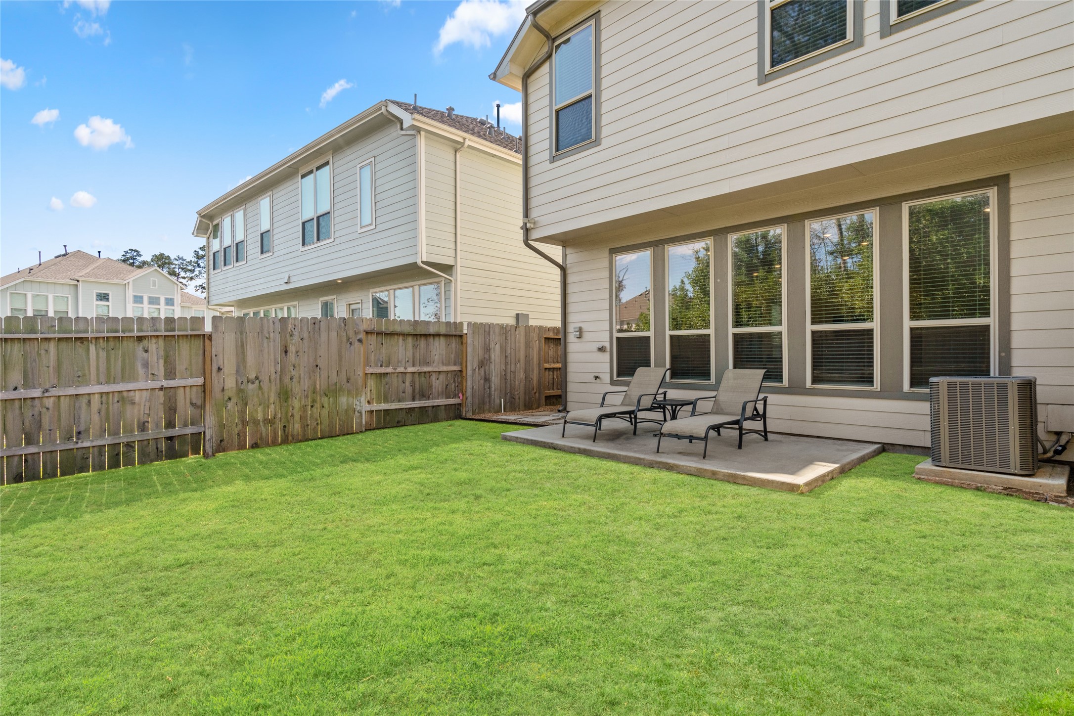 575 Dry Fork Lane Conroe, TX 77304 - Photo 29 of 34 a front view of house with yard and outdoor seating