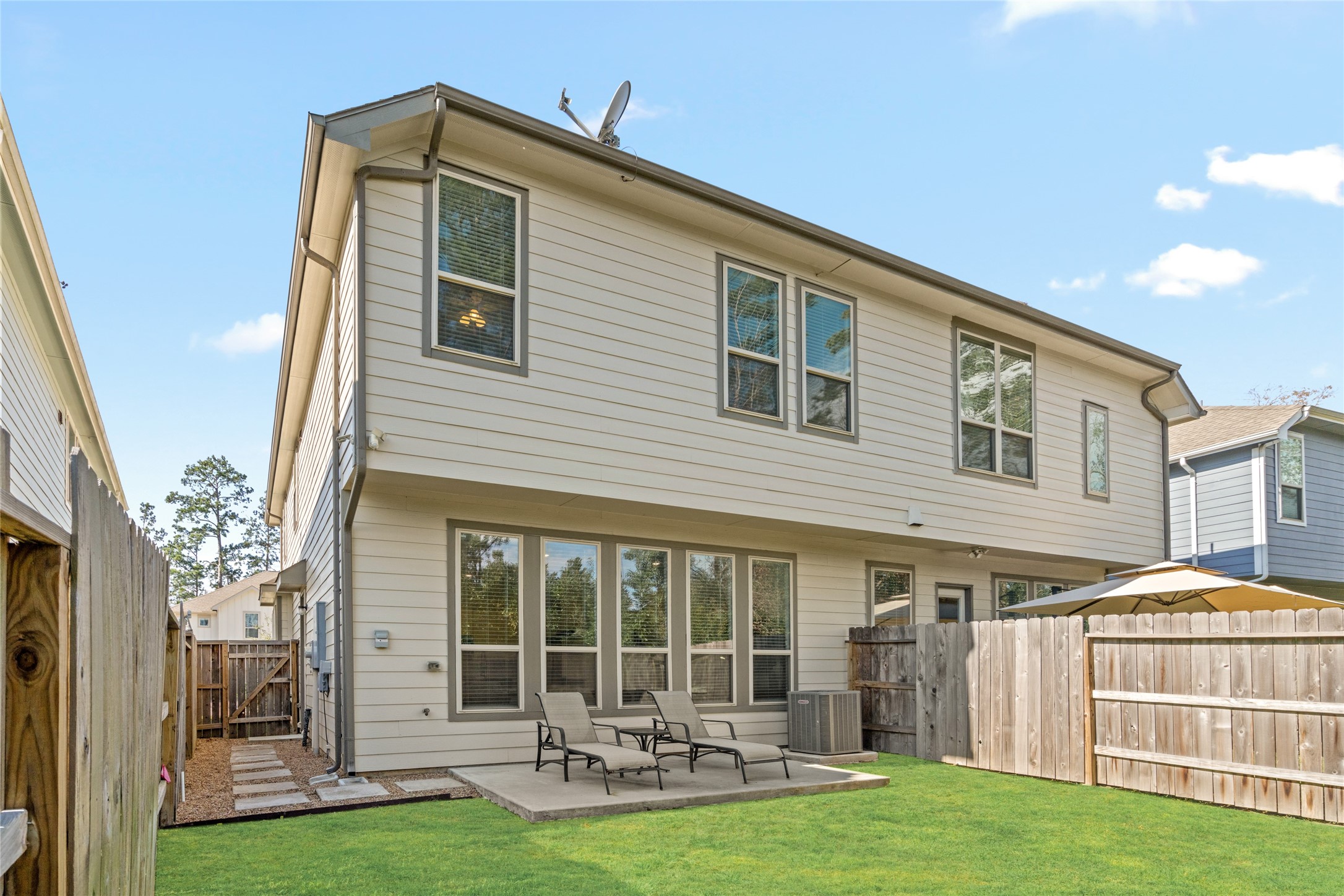 575 Dry Fork Lane Conroe, TX 77304 - Photo 31 of 34 a front view of a house with a yard table and chairs