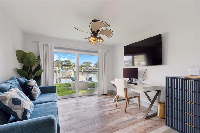 a view of a hallway with wooden floor and entryway