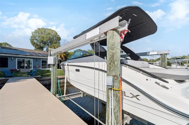 a kitchen with a sink stainless steel appliances and a window