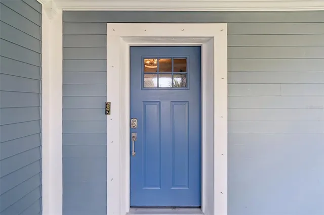 a view of a dining room with furniture wooden floor and a chandelier