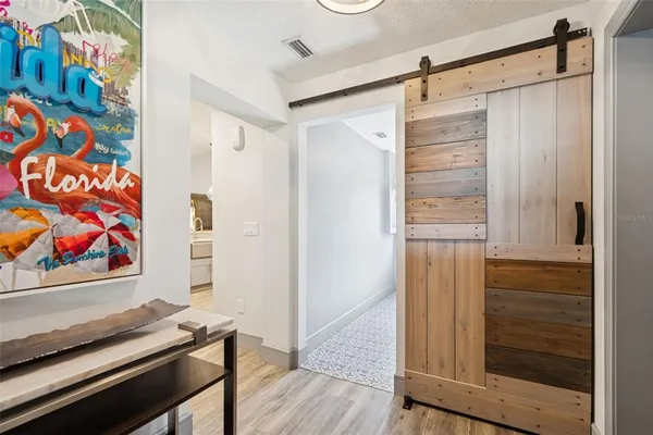 a bathroom with a glass shower door
