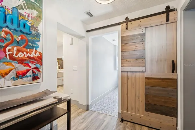 a bathroom with a glass shower door