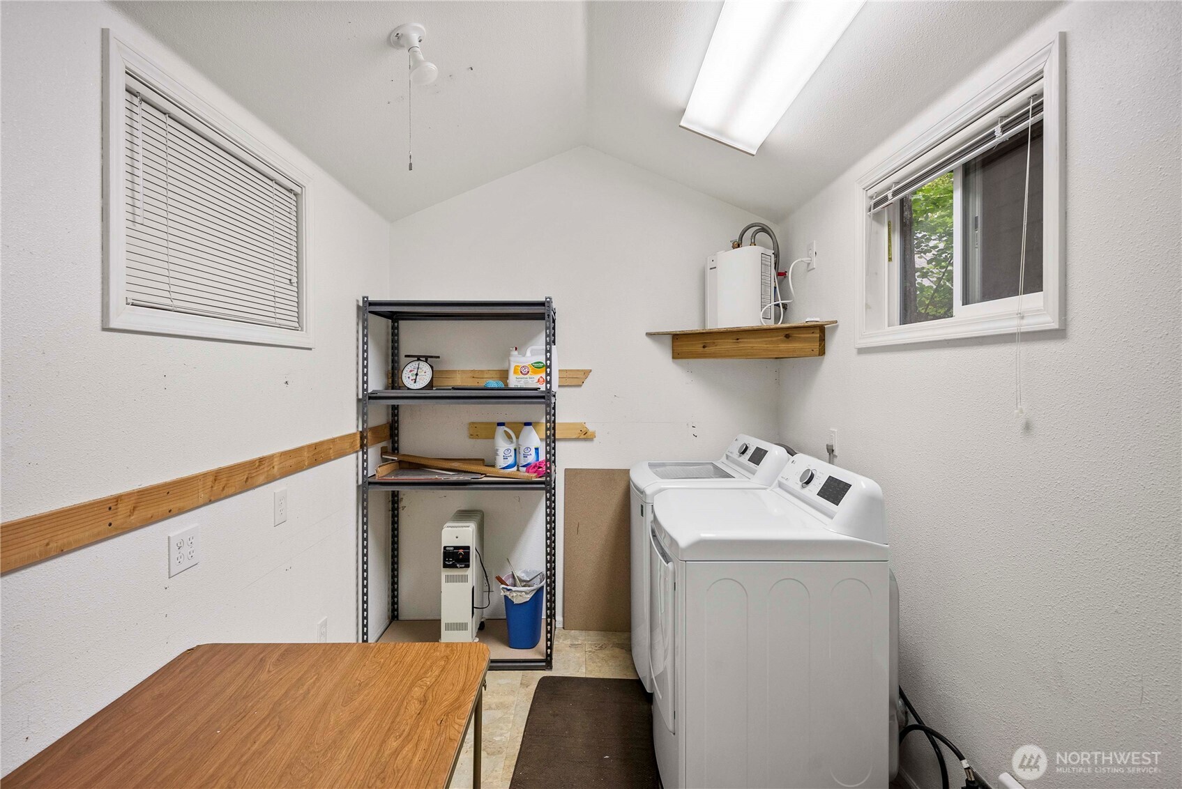 1546 Reservation Road Southeast, Unit 62 Olympia, WA 98513 - Photo 15 of 39 a view of storage and utility room with washer and dryer