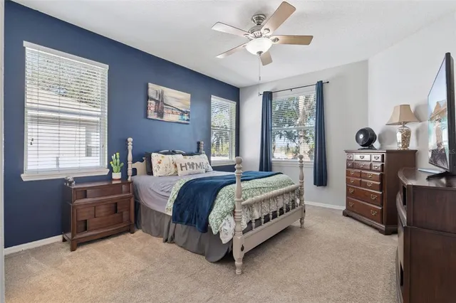 a bed room with a bed and a chandelier