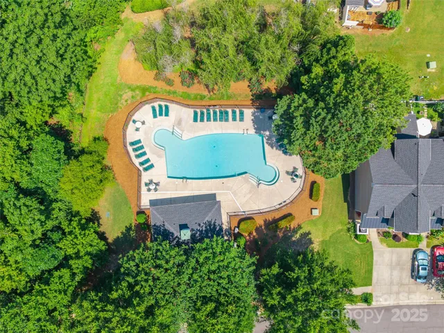 an aerial view of a house with outdoor space sitting area and garden