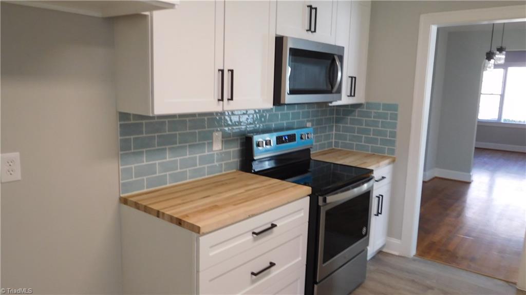 724 Sain Road Mocksville, NC 27028 - Photo 8 of 21 All New Stainless Steel dishwasher, microwave and range/oven.