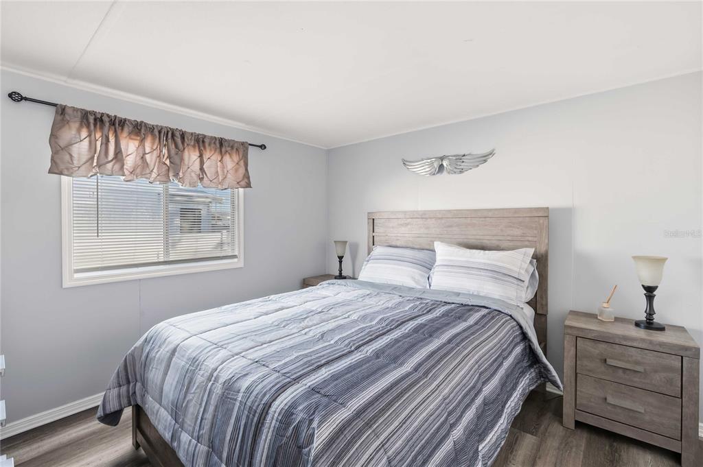 5408 Dean Dairy Road Zephyrhills, FL 33541 - Photo 14 of 62 a bedroom with a bed and a window