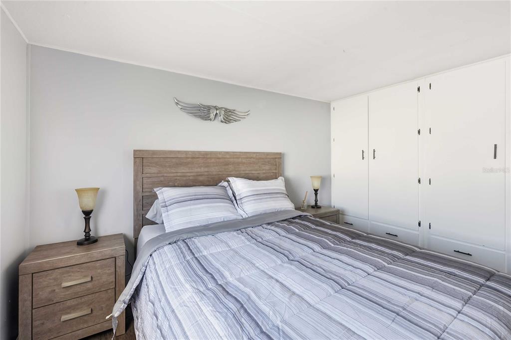 5408 Dean Dairy Road Zephyrhills, FL 33541 - Photo 15 of 62 a bedroom with a bed and mirror