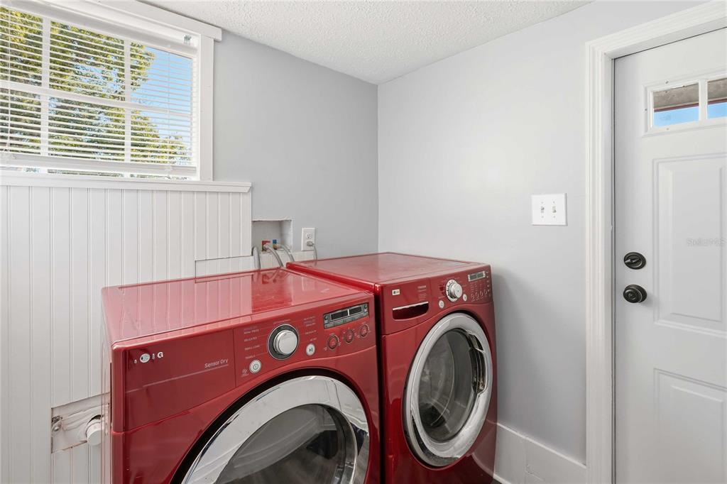 5408 Dean Dairy Road Zephyrhills, FL 33541 - Photo 20 of 62 a utility room with dryer and washer