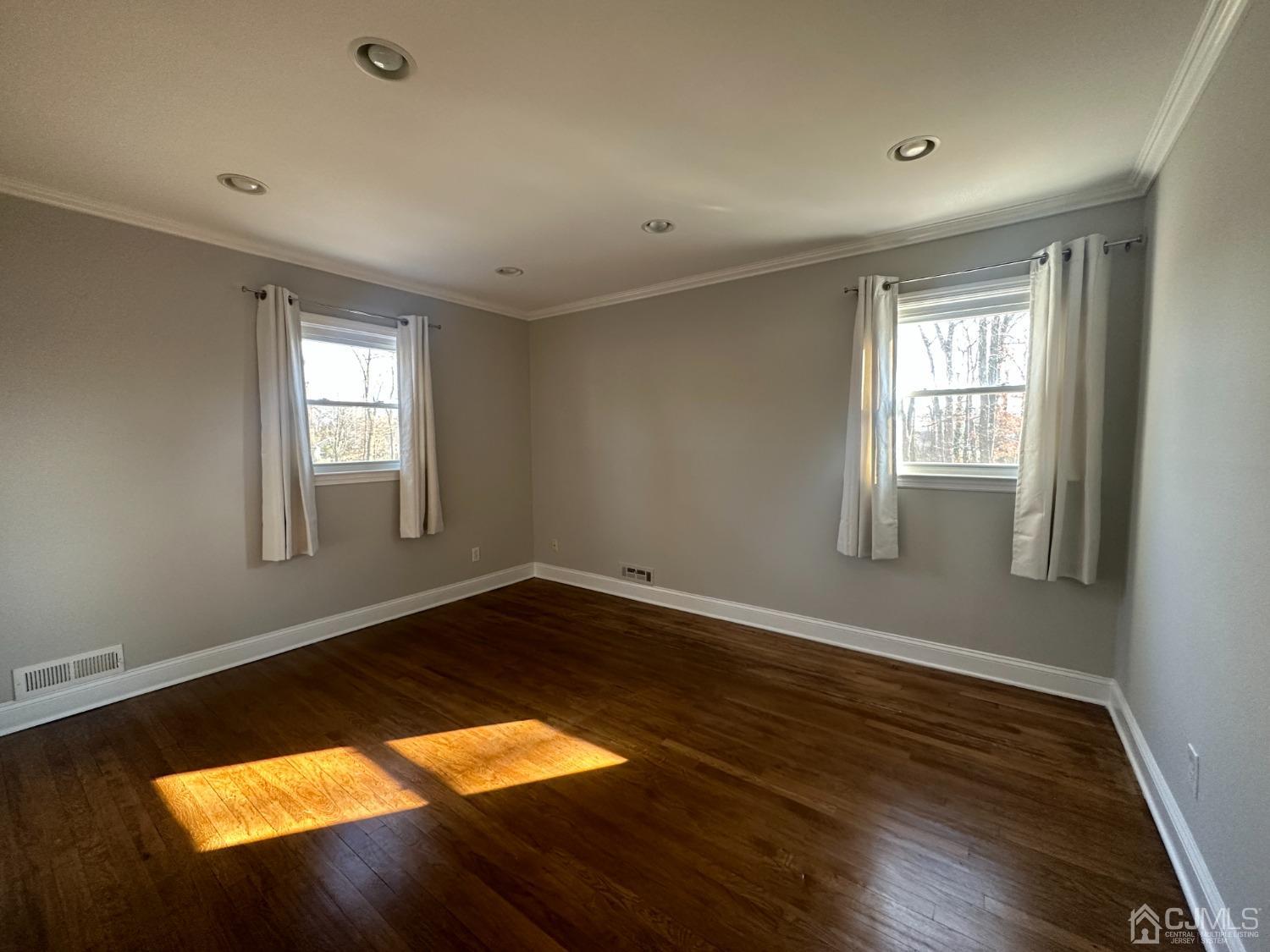 3 Hill Road Edison, NJ 08817 - Photo 14 of 27 a view of an empty room with wooden floor and a window