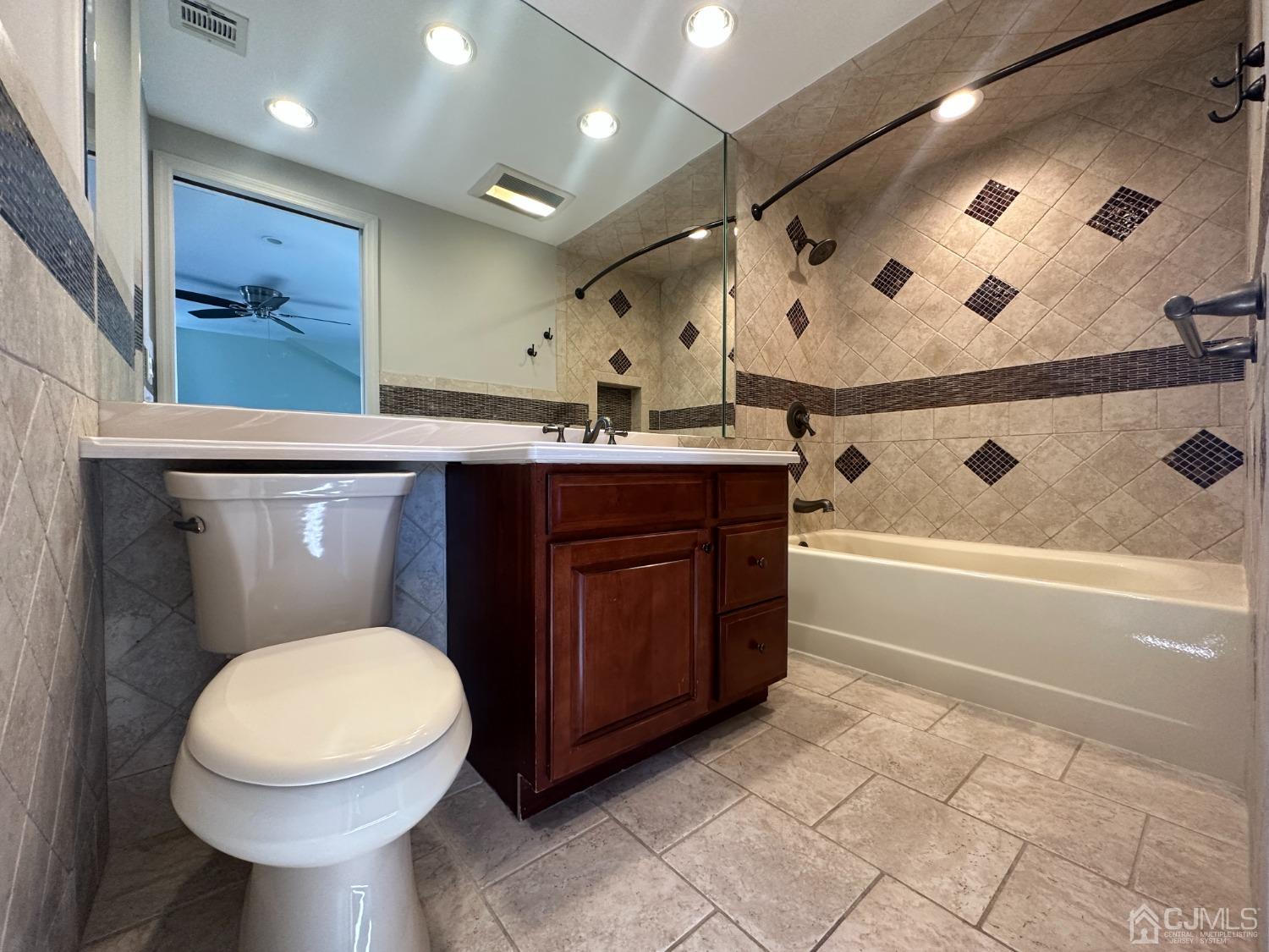 3 Hill Road Edison, NJ 08817 - Photo 19 of 27 a bathroom with a sink a toilet and bathtub