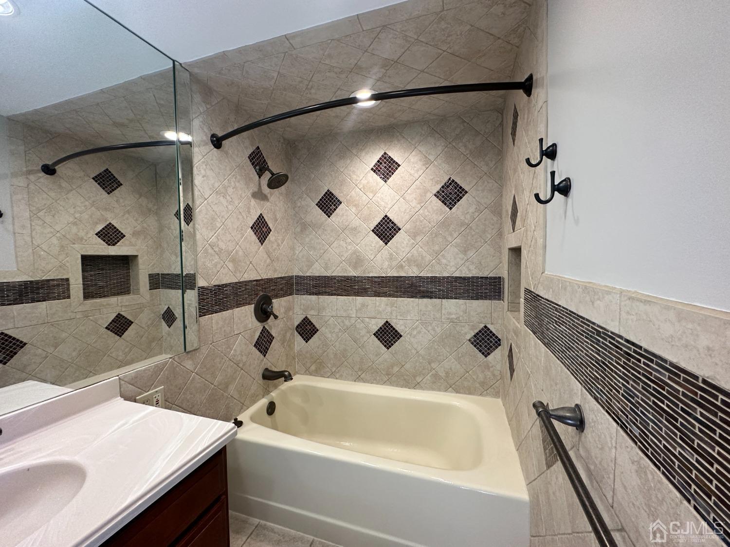 3 Hill Road Edison, NJ 08817 - Photo 20 of 27 a bathroom with a sink and a bathtub