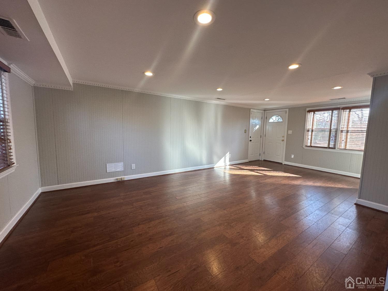 3 Hill Road Edison, NJ 08817 - Photo 22 of 27 an empty room with wooden floor and windows
