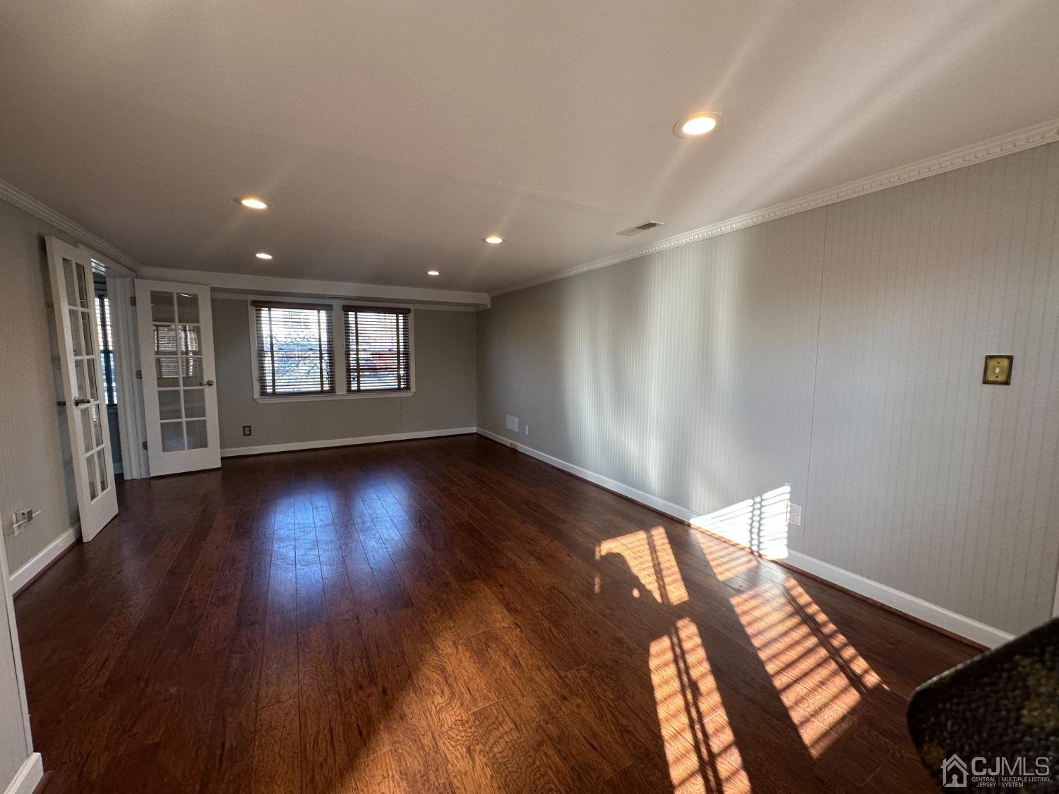 3 Hill Road Edison, NJ 08817 - Photo 23 of 27 a view of an empty room with wooden floor and a window