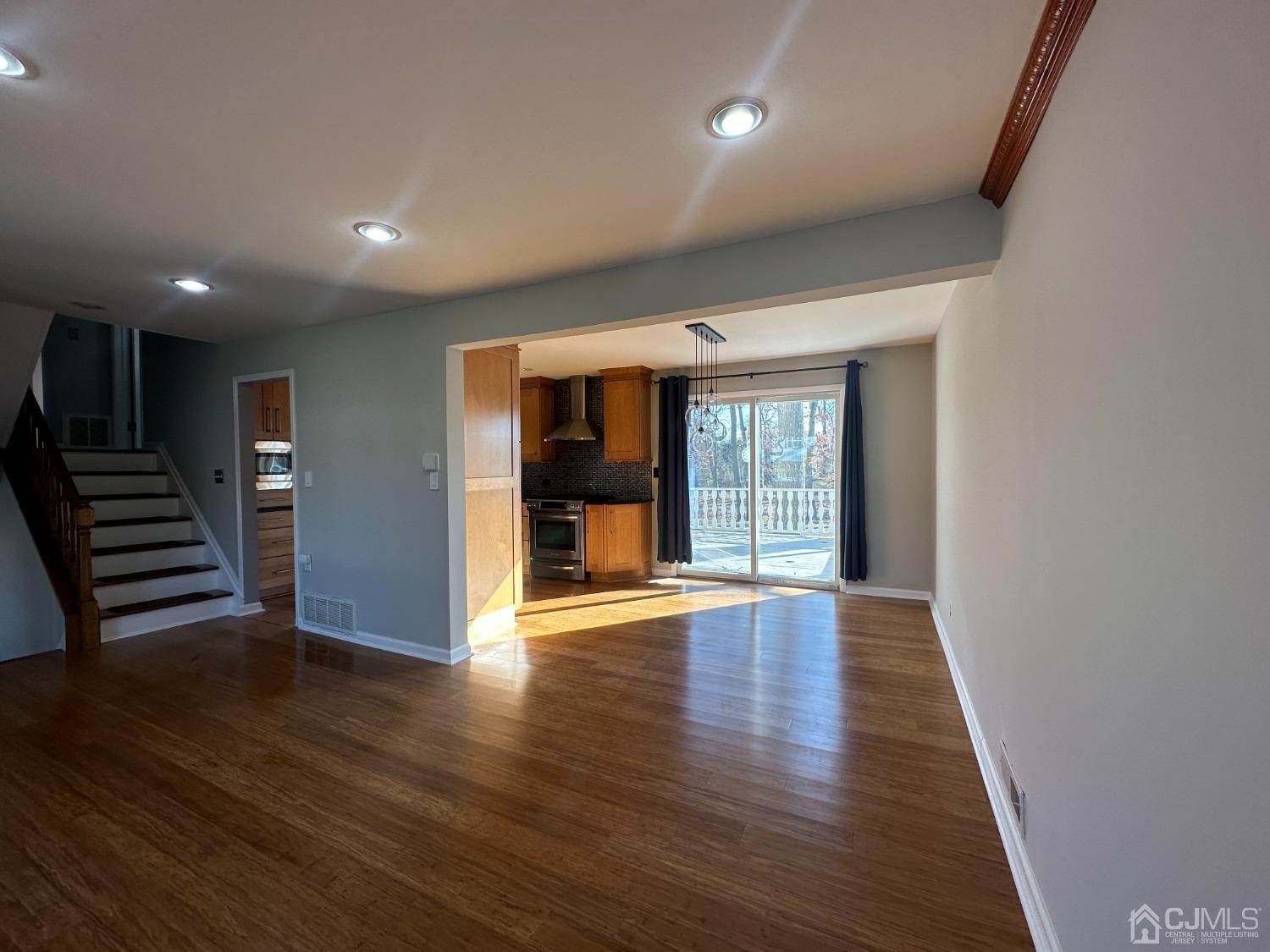 3 Hill Road Edison, NJ 08817 - Photo 6 of 27 a view of an empty room with wooden floor and a window