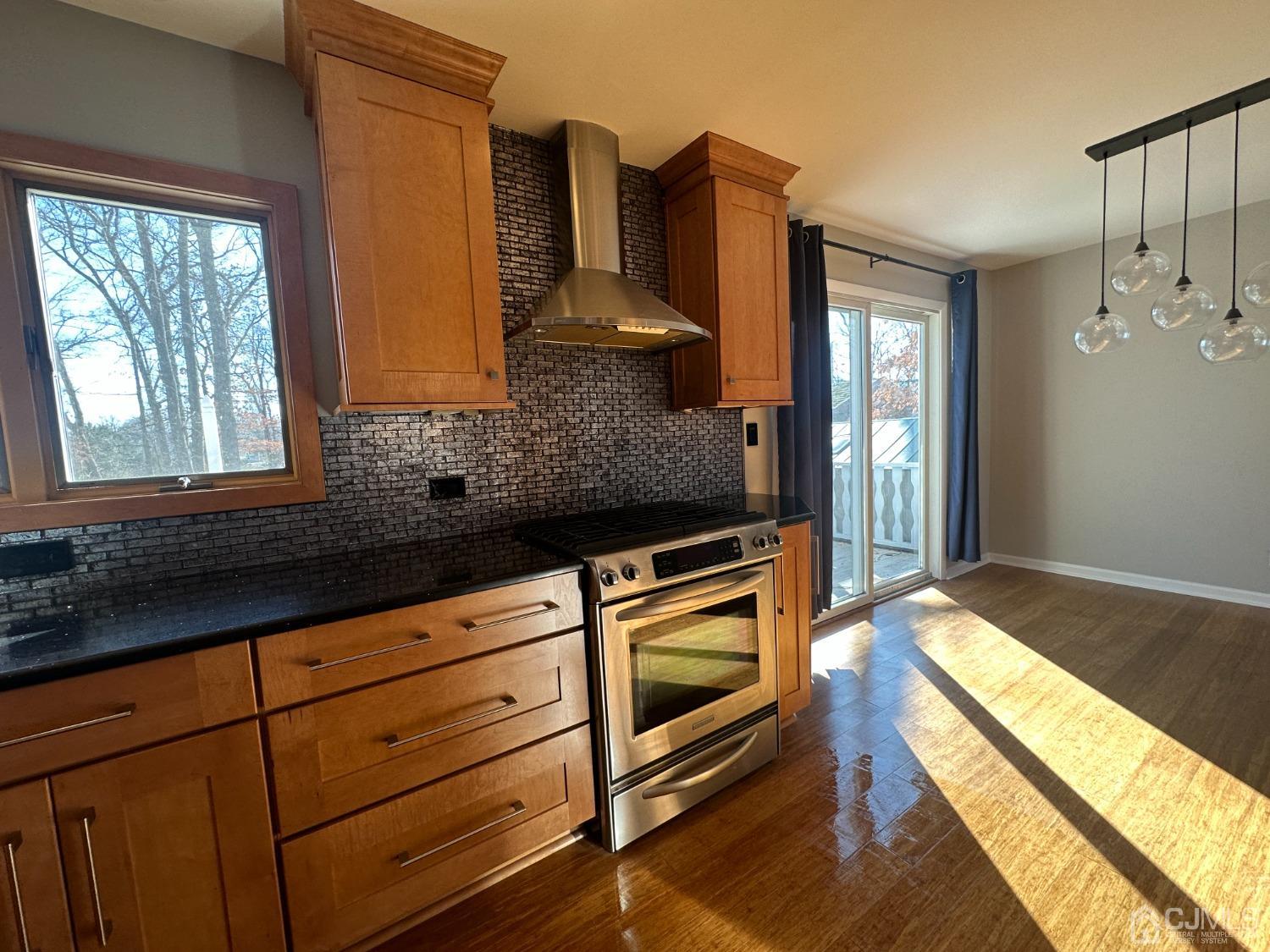 3 Hill Road Edison, NJ 08817 - Photo 7 of 27 a kitchen with stainless steel appliances granite countertop a stove a sink and a microwave oven