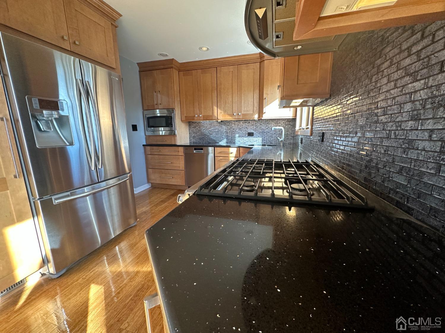 3 Hill Road Edison, NJ 08817 - Photo 10 of 27 a kitchen with a sink a stove and a refrigerator